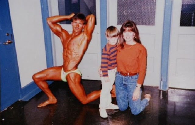 awkward family photo muscular dad
