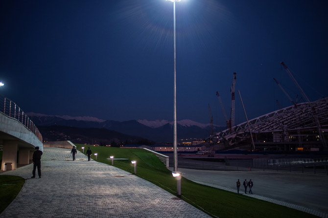 An Olympic stadium under construction. Those are the Caucasus Mountains in the background.
