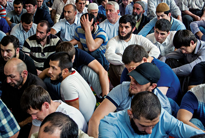 Muslims attend prayers at the central mosque in Nalchik, Kabardino-Balkariya, a region east of Sochi where militants have attacked local security forces