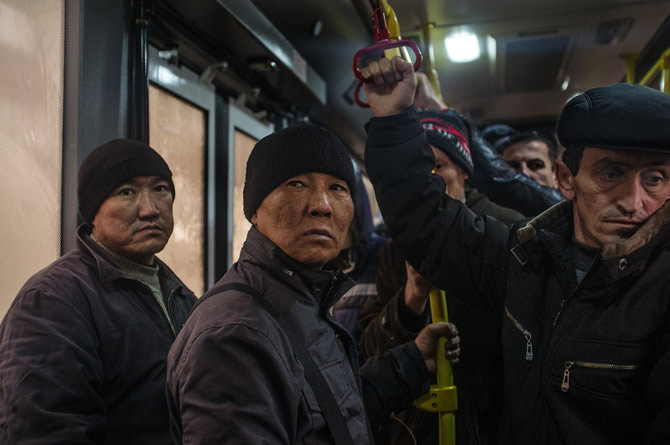 Krasnaya Polyana has been transformed by 20,000 migrant workers, including these Uzbeks riding a bus, who helped build the alpine Olympic sites. Many abuses against laborers have been reportedincluding denial of pay