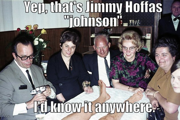 Group of people looking at jimmy hoffas Johnson.  lady with glasses knows it him for sure.