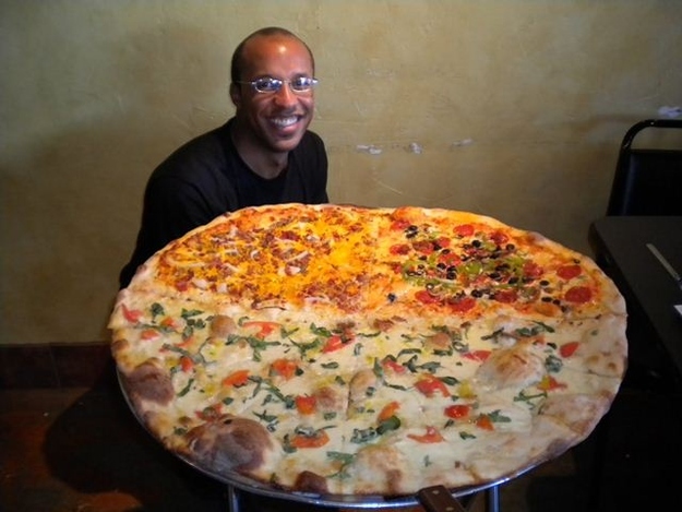 "11-pound Carnivore Pizza", Big Pie in the Sky. 30-inch pizza, weighing at...Of course, 11 pounds. 50 to enter the challange, and you can invite a friend to tag team while eating it.Prize: 250 dollars to each team.