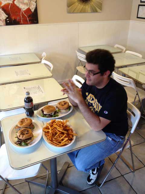 "Fiskies Wall of Fame Challenge", Fiskie's Cafe. 1 of each burger beef, veggie, turkey, and chicke, and 12 pounds of fries in a half hour. Prize: your picture on the Wall of Fame.