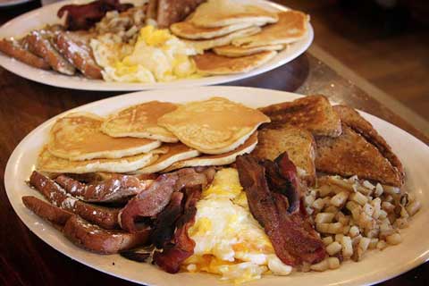 "Green Mountain Feast", Pittsburgh's Original General Store.Eat 6 buttermilk pancakes, double order of French Toast, 6 eggs, 6 strips of bacon, a double order of home fries and a double order of toast in under 30 Minutes. Prize: your picture on the Wall of Fame.