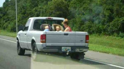 bad parenting children on pickup truck