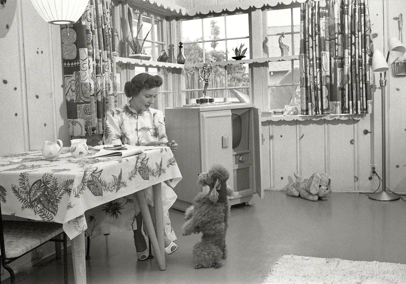 Actress Betty White at home with her dog, Los Angeles circa 1952