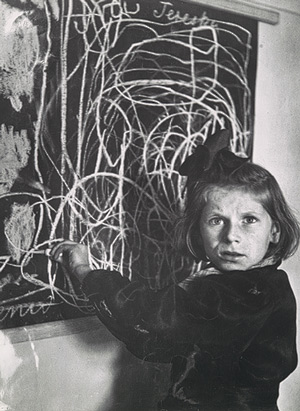 Tereska, a child in a residence for disturbed children, grew up in a concentration camp. She drew a picture of "home" on the blackboard, Poland, 1948