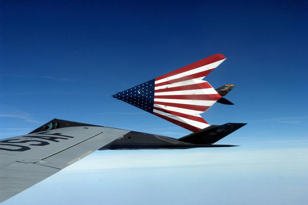 A pair of specially painted F-117 Nighthawks fly off from their last refueling by the Ohio National Guard's 121st Air Refueling Wing. The F-117s were retired March 11 in a farewell ceremony at Wright-Patterson Air Force Base, Ohio.