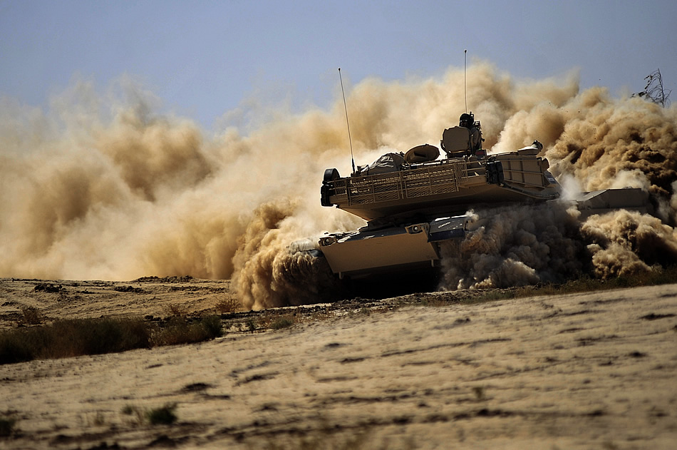 Iraqi army soldiers maneuver an M1 Abrams tank on a range in Besmaya, Iraq, Oct. 10, 2011.
