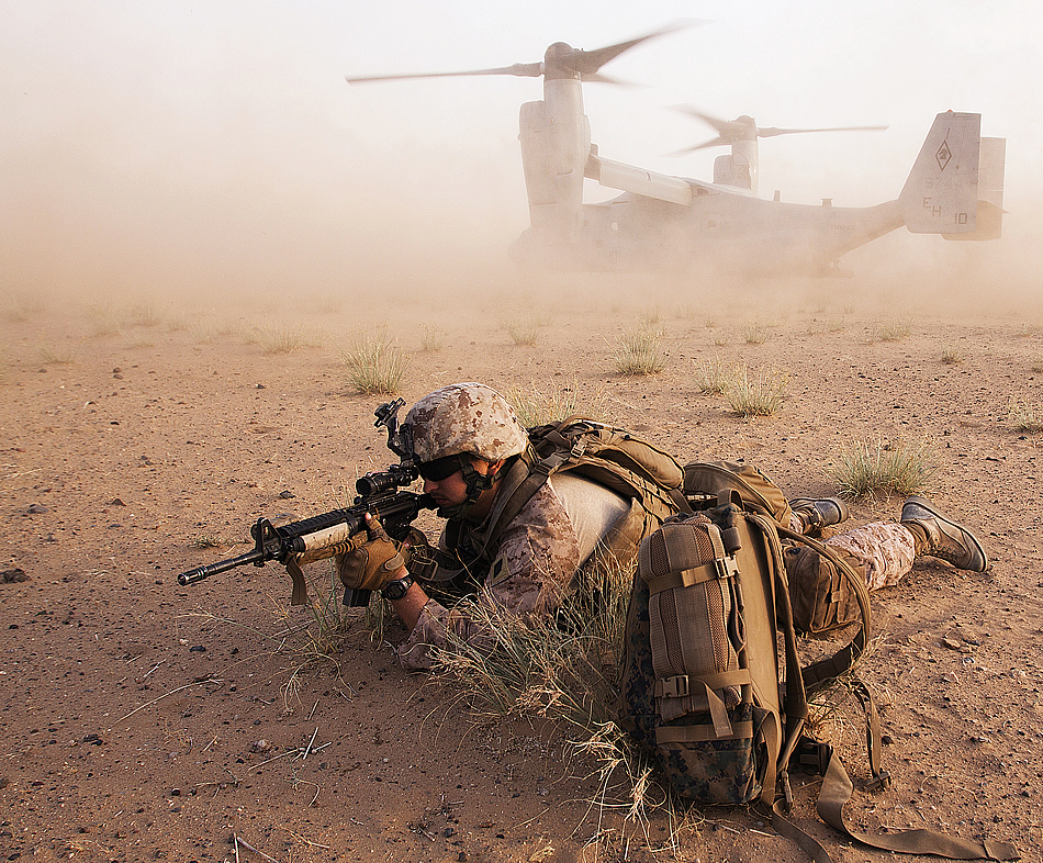 GARMSIR DISTRICT, Helmand province, Islamic Republic of Afghanistan - Navy Seaman Daniel Freeman provides security as his squad exits a V-22 Osprey during Operation Black Dawn. May 17.
