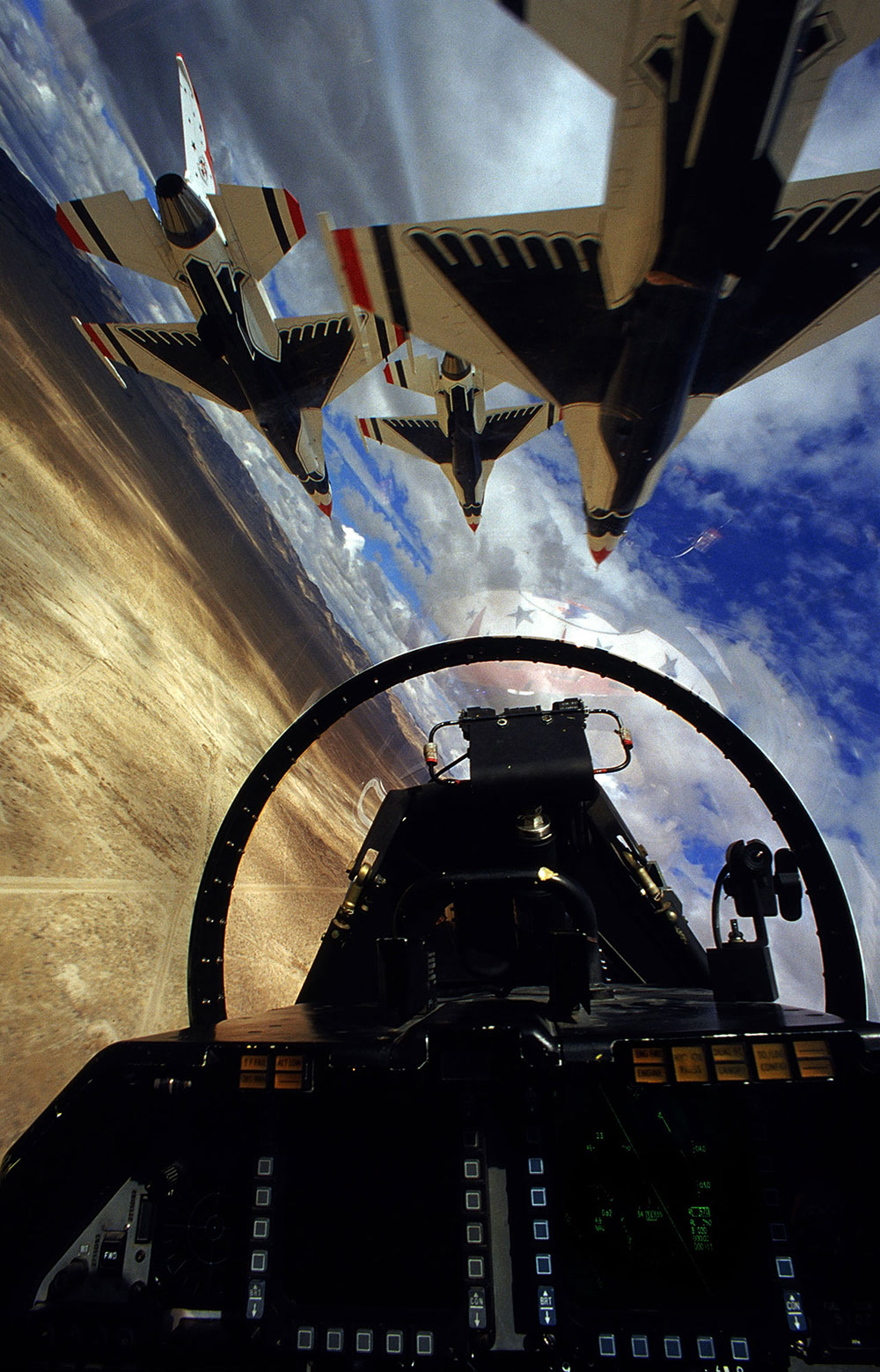 View from the cockpit of an F-16, while flying in formation. This is the widely known aerobatics team known as the Thunderbirds.
