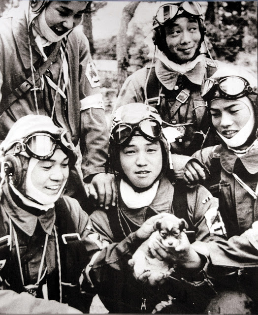 Kamikaze pilots moments before a suicide mission with puppy