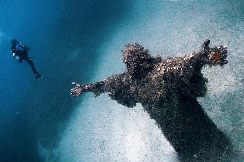 Underwater statue of Jesus on the sea bed in Malta