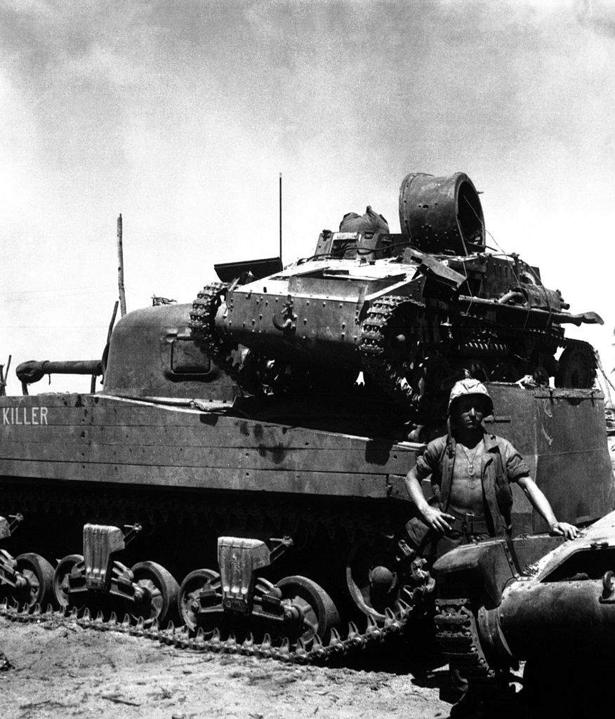 An American M4A2 carrying a Japanese Type 94 light-tank on its back, Namur, 1944.