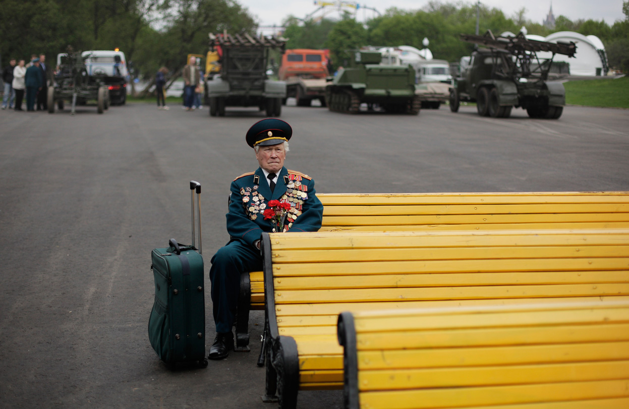 World War II veteran from Belarus Konstantin Pronin, 86, sits on a bench as he waits for his comrades at Gorky park during Victory Day in Moscow, Russia, on Monday, May 9, 2011. Konstantin comes to this place every year after WWII finished. This year he was the only person from the unit.