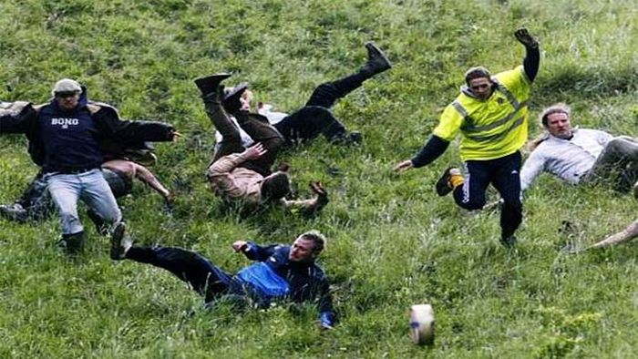 Coopers Hill Cheese Rolling-Imagine 30 grown men running down a hill trying to catch a rolling cheese. Every year this is exactly what happens on Coopers Hill in England.