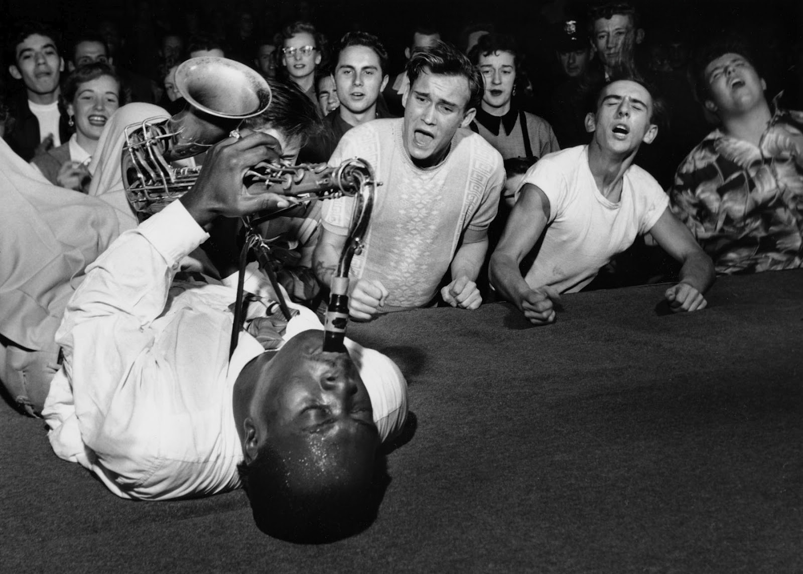 Big Jay McNeely driving the crowd at the Olympic Auditorium into a frenzy, Los Angeles, 1953