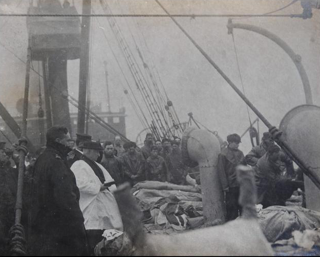 Rare picture shows priest praying over Titanic victims before they are buried at sea