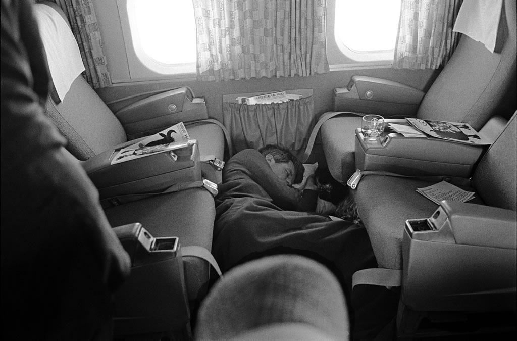Robert F. Kennedy sleeps on the floor of a plane during his 1968 presidential campaign