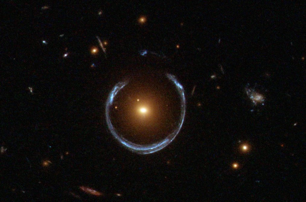Gravitational Lensing-What you are looking at is actually a blue star directly behind a yellow star. Light is just being bent so the blue star gets warped.