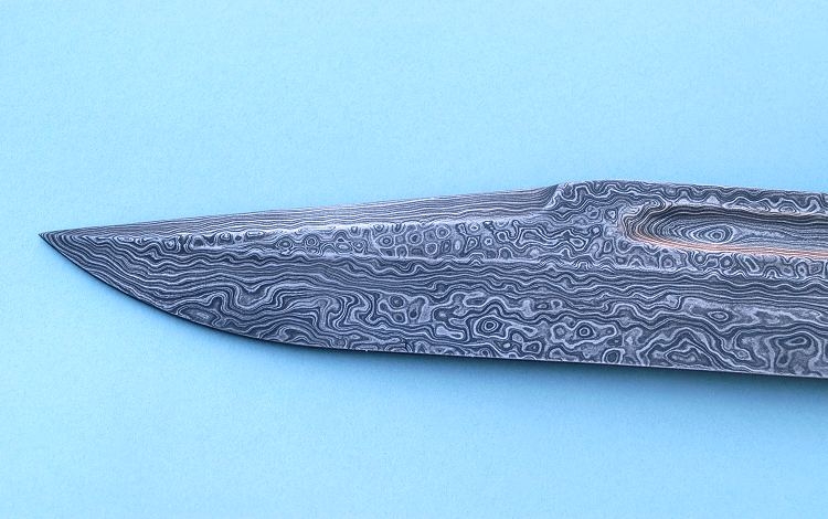 Damascus steel was a type of steel used in South Asian and Middle Eastern swordmaking. Damascus steel was created from wootz steel, a steel developed in India around 300 BC. These swords are characterized by distinctive patterns of banding and mottling reminiscent of flowing water. Such blades were reputed to be tough, resistant to shattering and capable of being honed to a sharp, resilient edge. The original method of producing Damascus steel is not known. Because of differences in raw materials and manufacturing techniques, modern attempts to duplicate the metal have not been entirely successful. Despite this, several individuals in modern times have claimed that they have rediscovered the methods in which the original Damascus steel was produced.