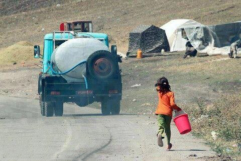 Little girl was a bit late to get water, desperately trying to stop the truck.