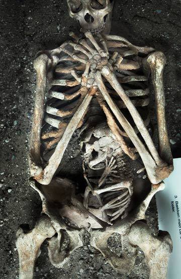 A skeleton of a mother, and her baby, who both died during her pregnancy.