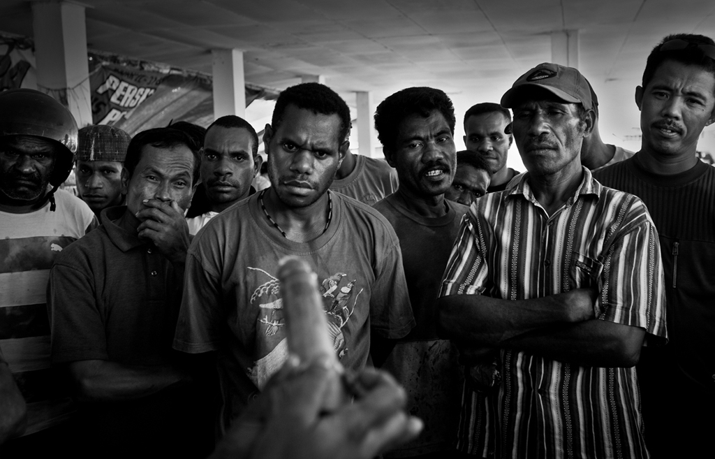 Demonstration of condom usage at a market in Papua