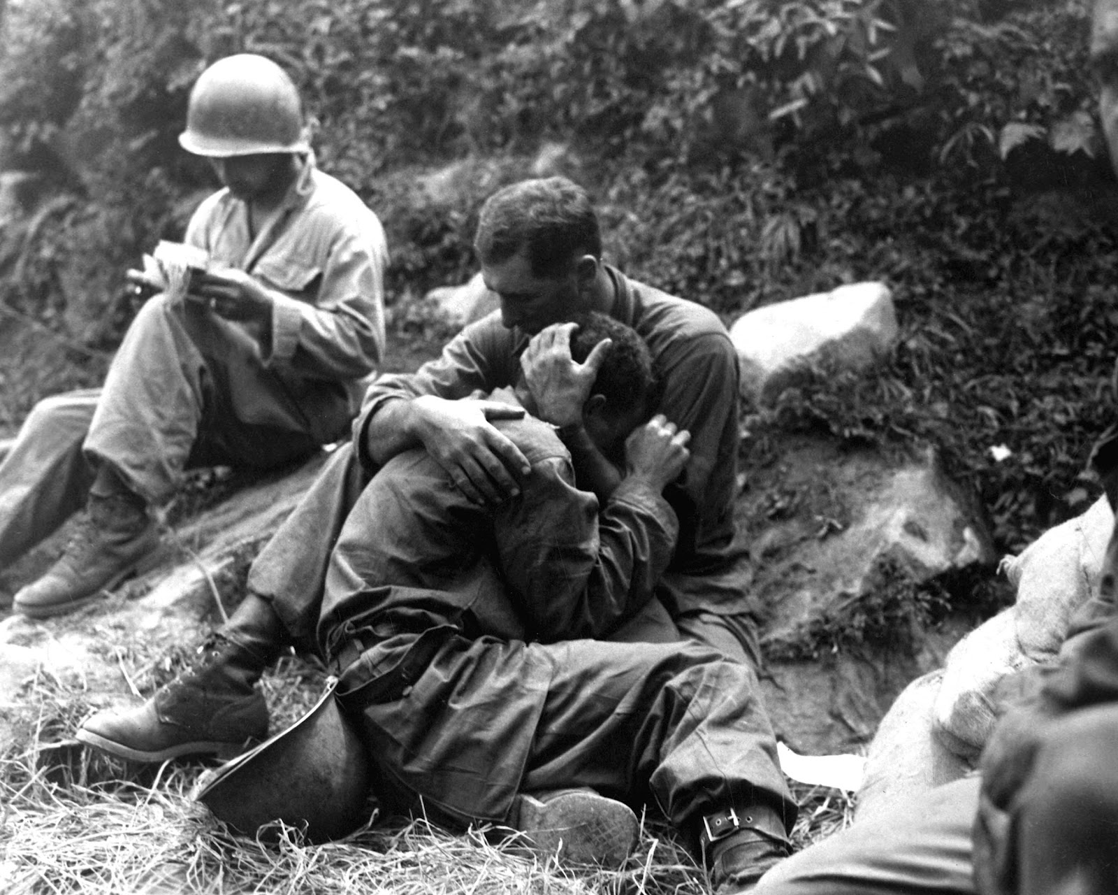 Soldiers comfort each other during the Korean war in the early 1950s