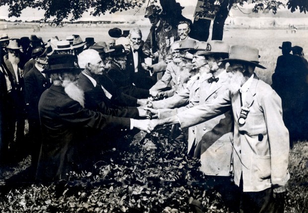 The 1913 Gettysburg reunion of 53,407 American Civil War vetererns of the Battle of Gettysburgs 50th anniversary shake hands