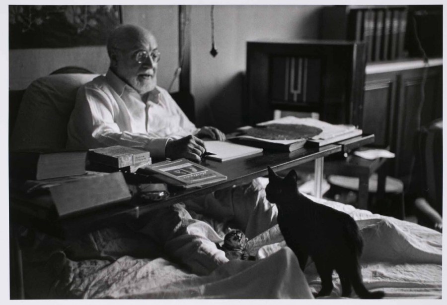 Matisse working in bed, his cats at his feet Nice, France,1949