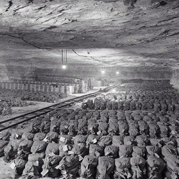 Over 7,000 bags of ornamental gold and silver, obviously looted from private homes by the Nazis, were discovered after Gen. Patton ordered the vault door blown open. All the articles had been flattened by hammers and were intended to be melted down into gold or silver bars. Spring 1945