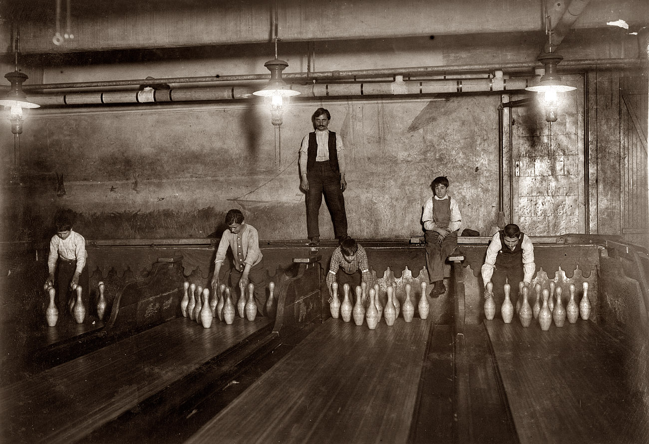 1:00 AM. Pin boys working in Subway Bowling Alleys, Brooklyn NYC, every night. 3 smaller boys were kept out of the photo by the boss. April, 1910