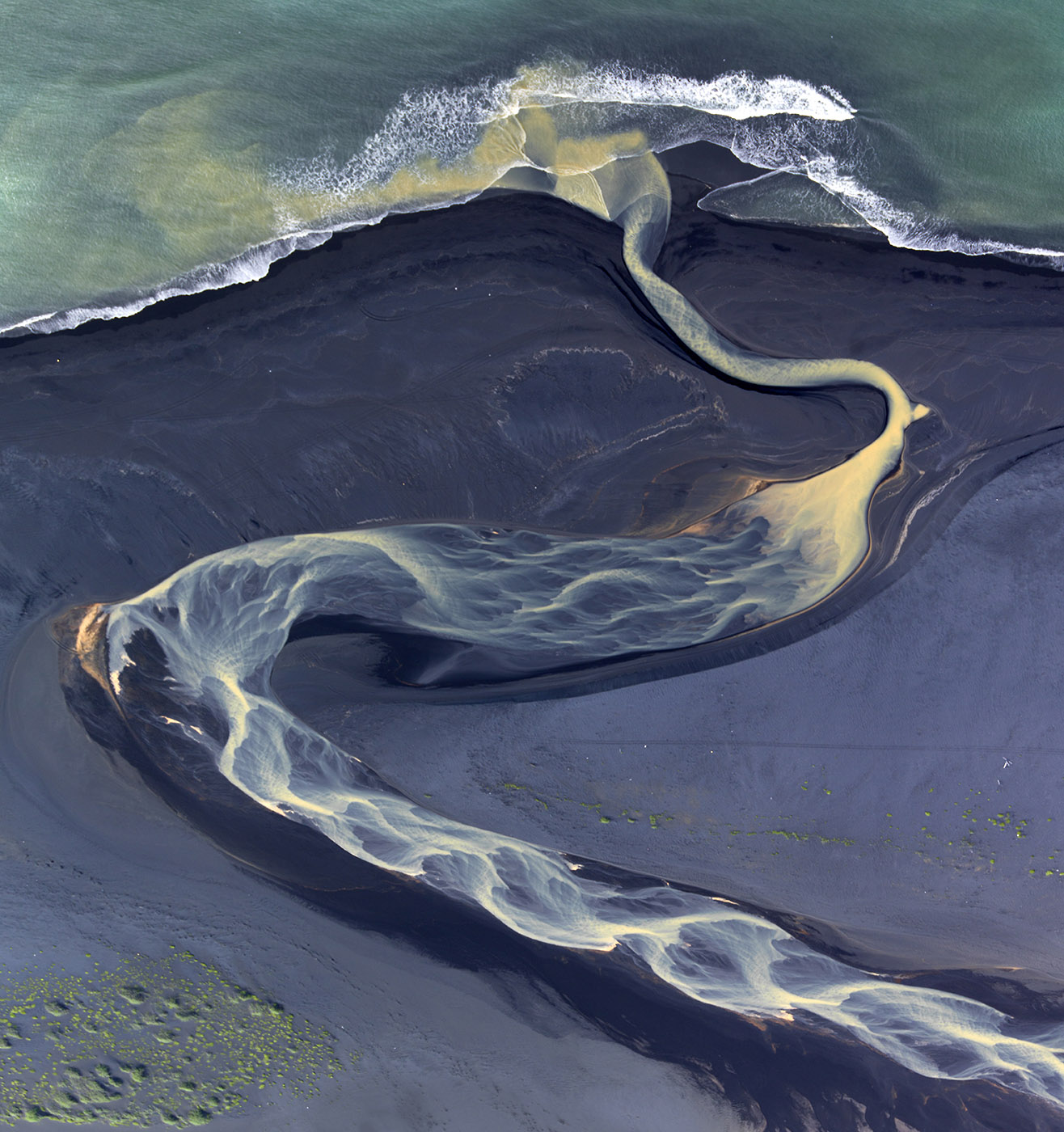 An Icelandic river reaching the ocean