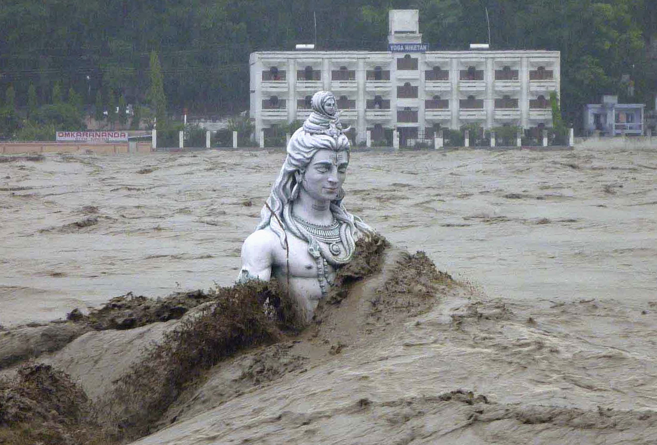 A submerged statue of the Hindu Lord Shiva amid the flood waters of the river Ganges, June 17, 2013