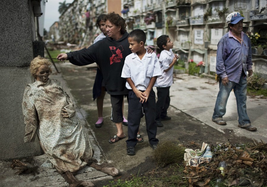 Bodies exhumed from their graves and left propped up in Guatemala after relatives failed to pay the cemetery fees