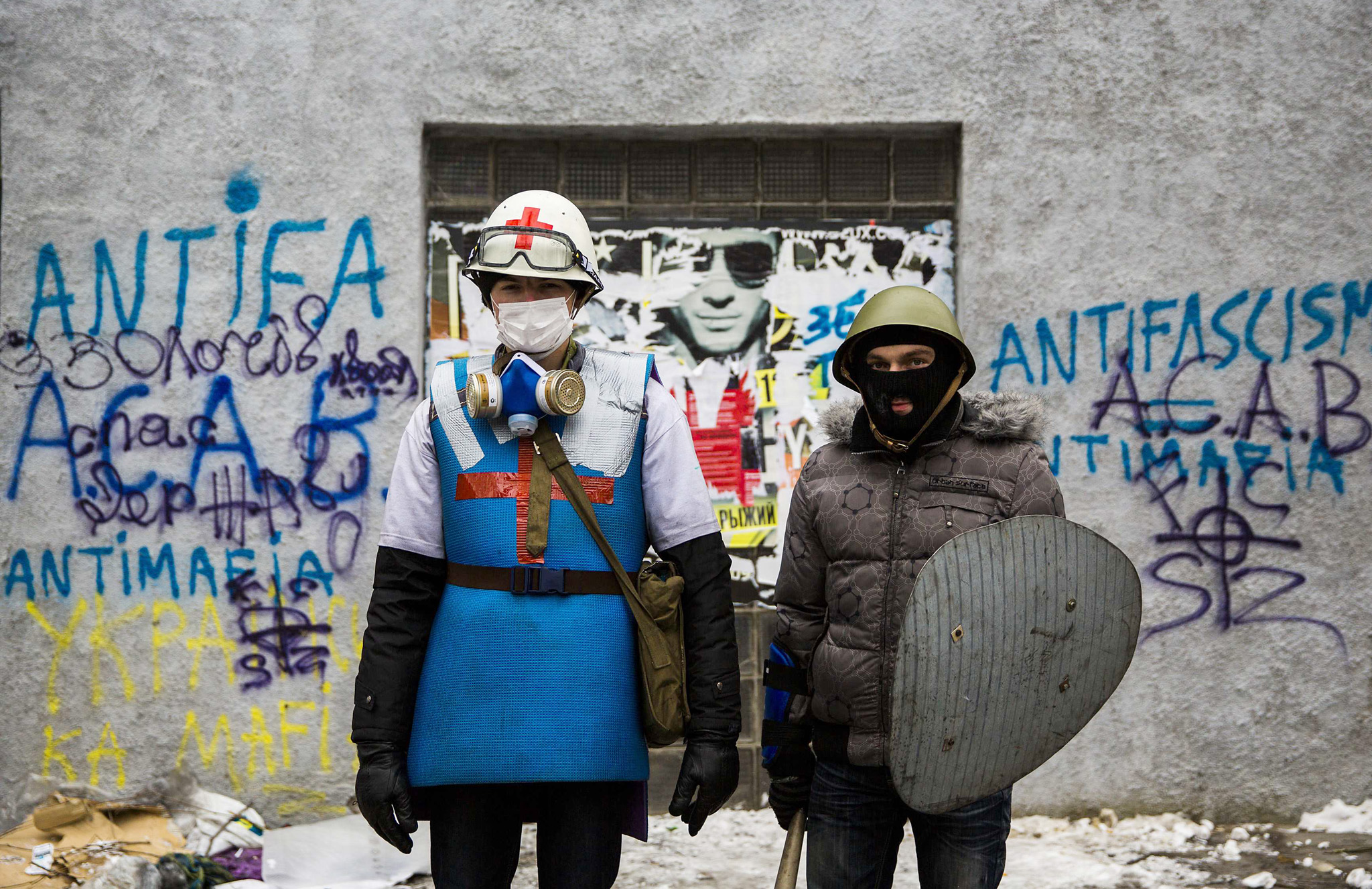Ukraine looks more and more like a post-apocalyptic video game. Medical worker and his body guard