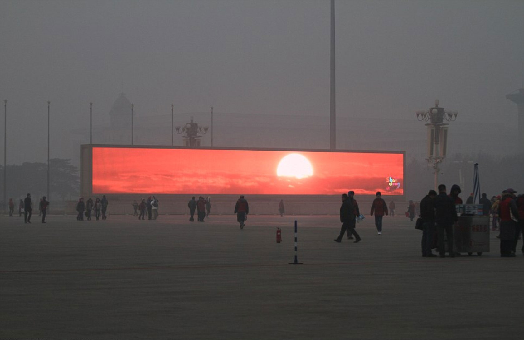 China starts televising the sunrise on giant TV screens because Beijing is so clouded in smog