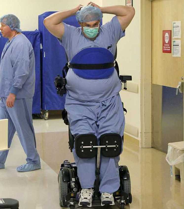 Dr. Ted Rummel of Missouri was paralyzed in 2010 but still operates on his patients by using a stand-up wheelchair.