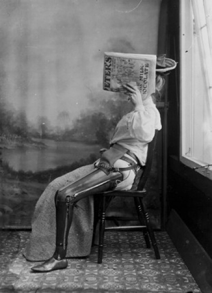 Woman with an artificial leg, too embarrassed to show her face c. 1890-1900