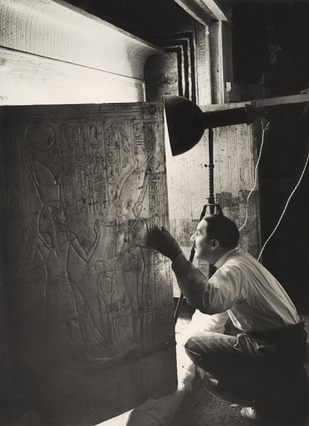 Howard Carter Looking through the Open Doors of Tutankhamun's Second Shrine, January 1924