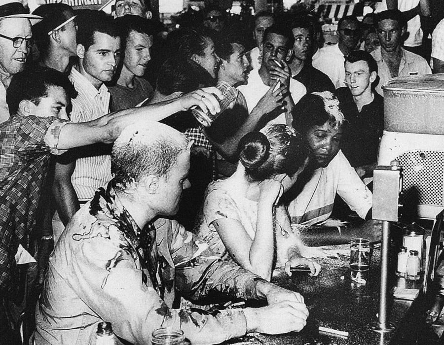 Civil rights protesters endure jeers, harassment, and being covered in ketchup and sugar at a sit-in in Jackson Mississippi, 1963