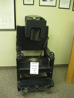 Chair used to calm hysterical patients--looks an awful lot like an electric chair