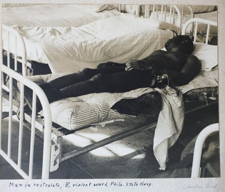 Philadelphia State Hospital at Byberry. Man in restraints, B, violent ward. 1945.