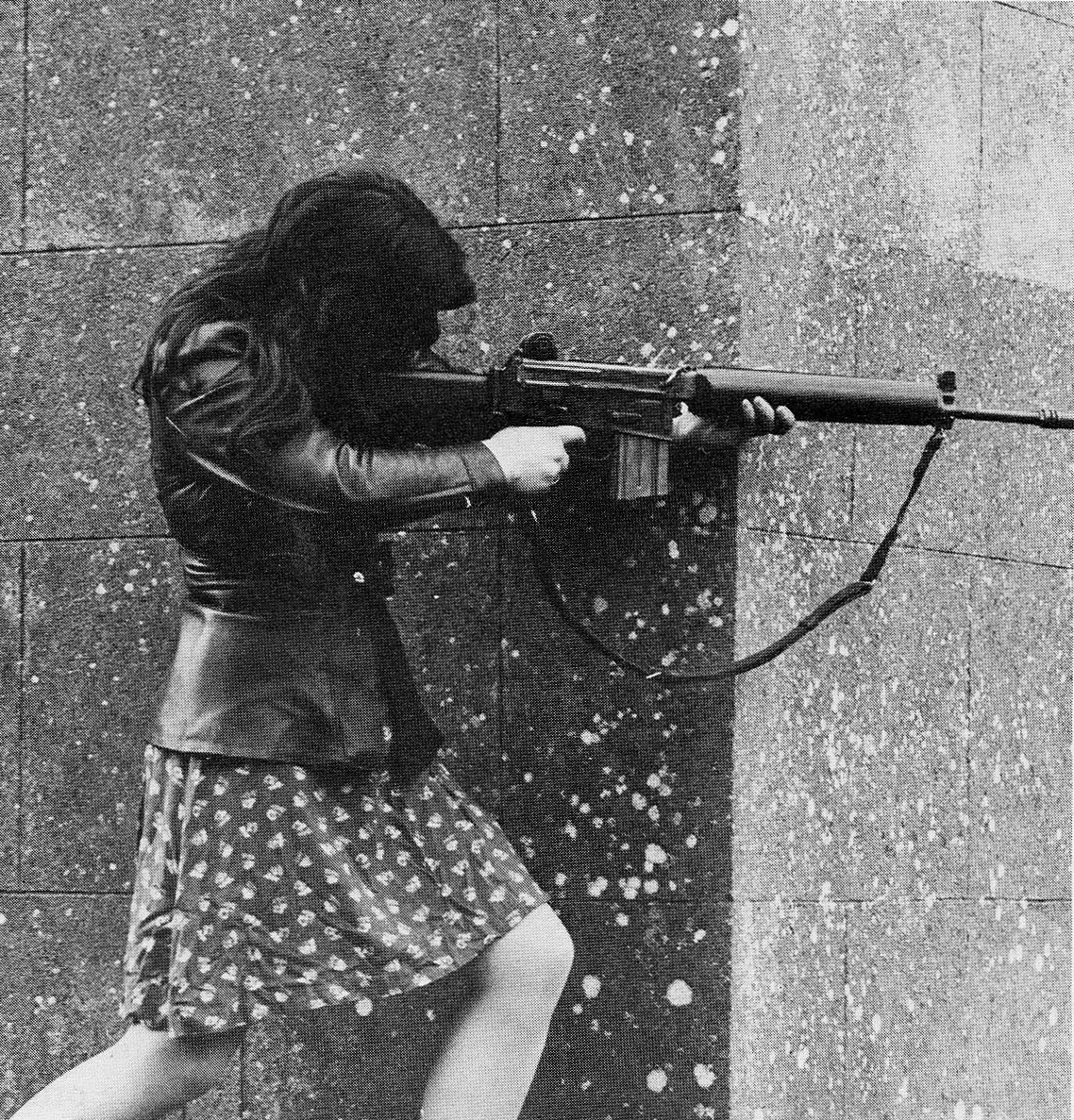 IRA fighter fires an AR-18 at Pro-British troops during skirmishes in County Armin, Northern Ireland, 1972.