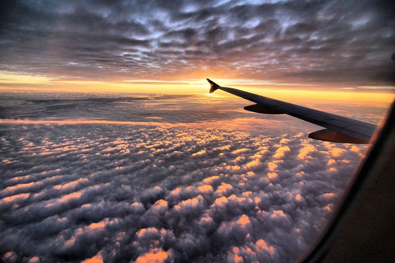 sunset airplane clouds
