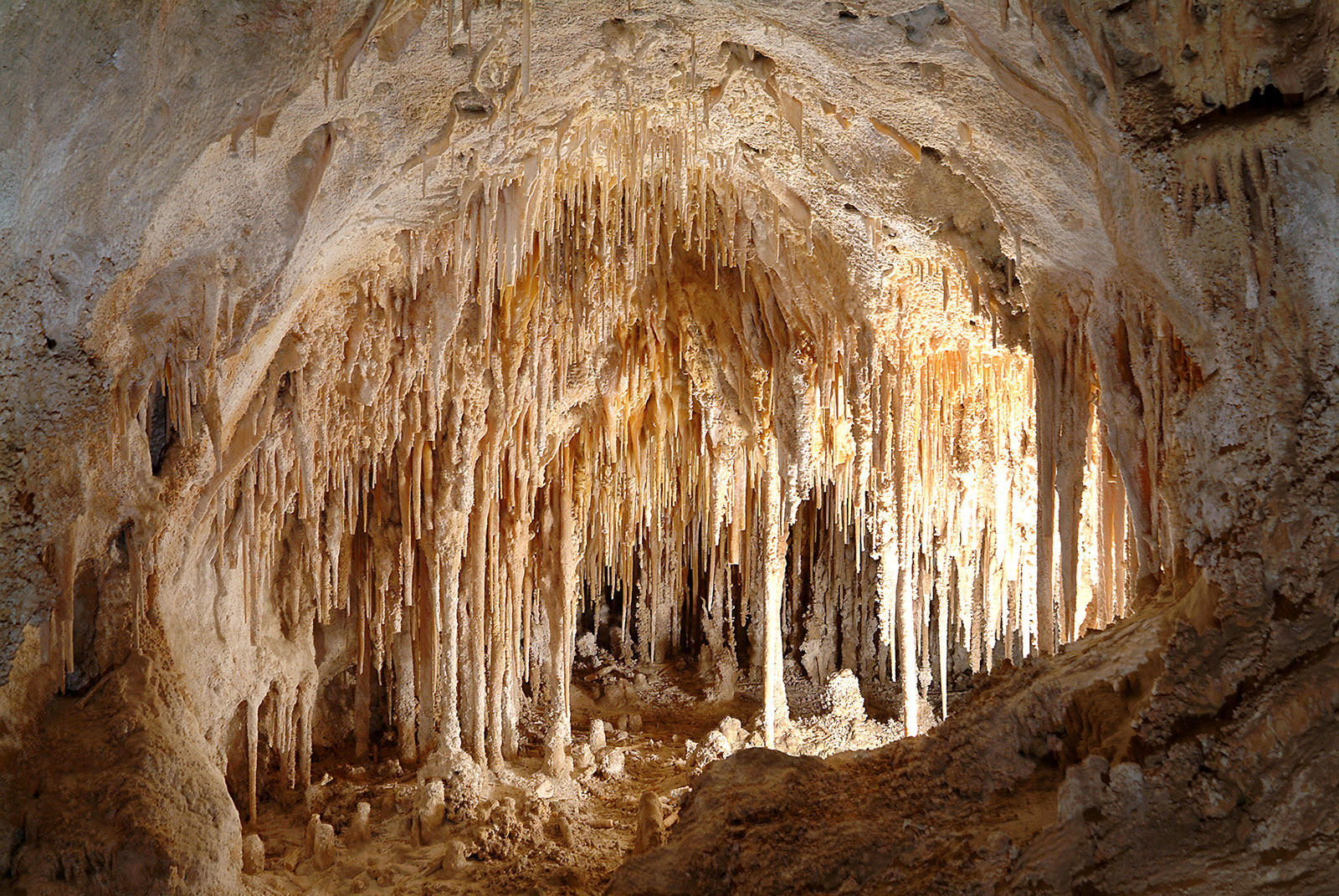 Carlsbad Caverns USA- Located in what is now New Mexico, the Carlsbad Caverns National Park is home to many impressive caves, all of which were created between 4-6 million years ago. Sulfuric acid formed from mixed water dissolved the area's limestone, widening cracks in the rock and eventually creating the caves we know today. What makes these caves truly notable, though, are the massive deposits of gypsum, clay, and silt, whose presence gives the caves a fantastical and almost cartoonish look.