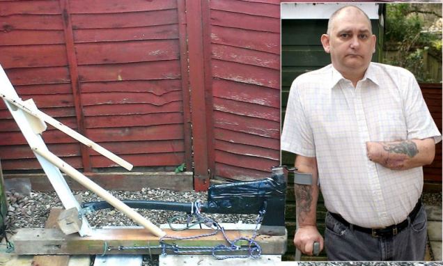 Man builds a guillotine and chops off his own hand in bid to end 16 years of agony after doctors refused to amputate.
