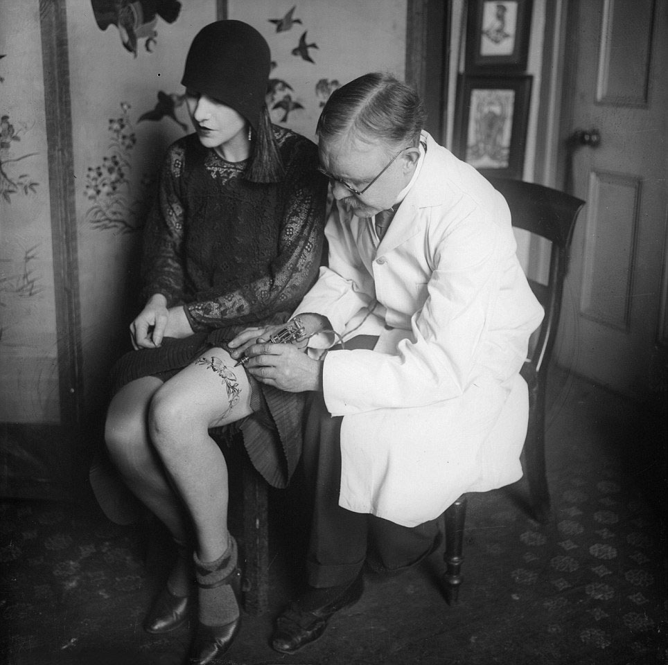 Tattooing a butterfly garter belt, 1930s