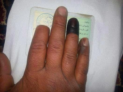 Taliban cut his finger in last election, today he voted with another finger. They dye your finger when you vote so they can keep track of who has already voted.